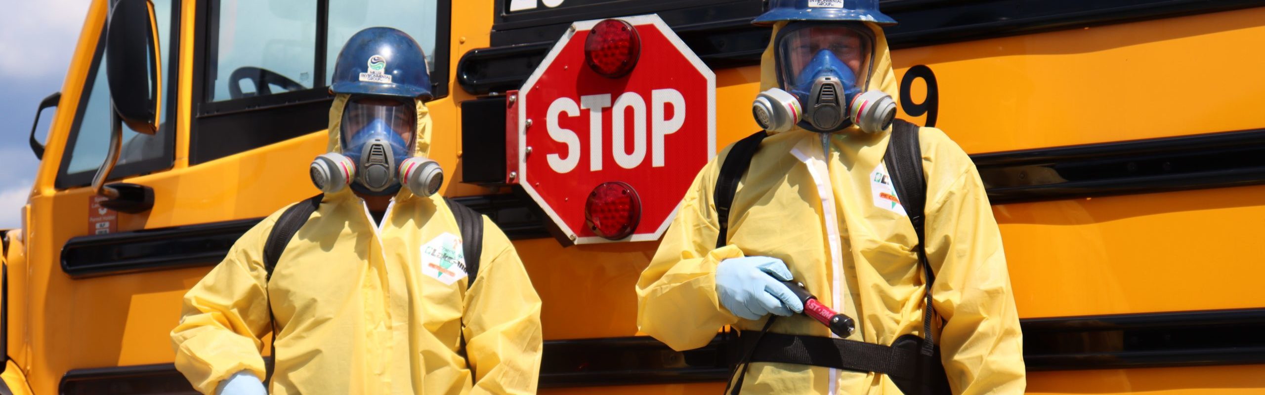 MEG Employees in PPE for decontamination