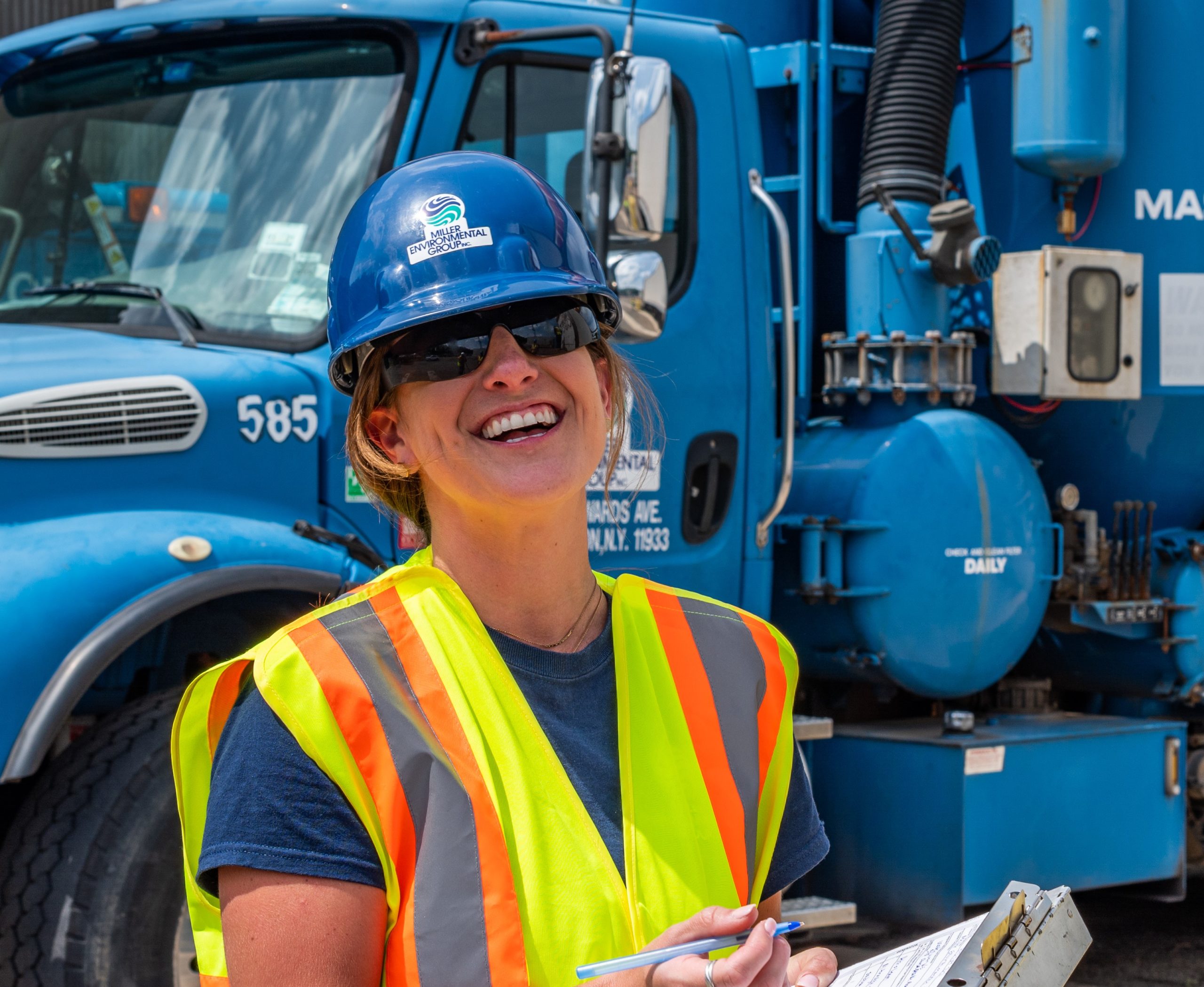 MEG Employee smiling at team memebers